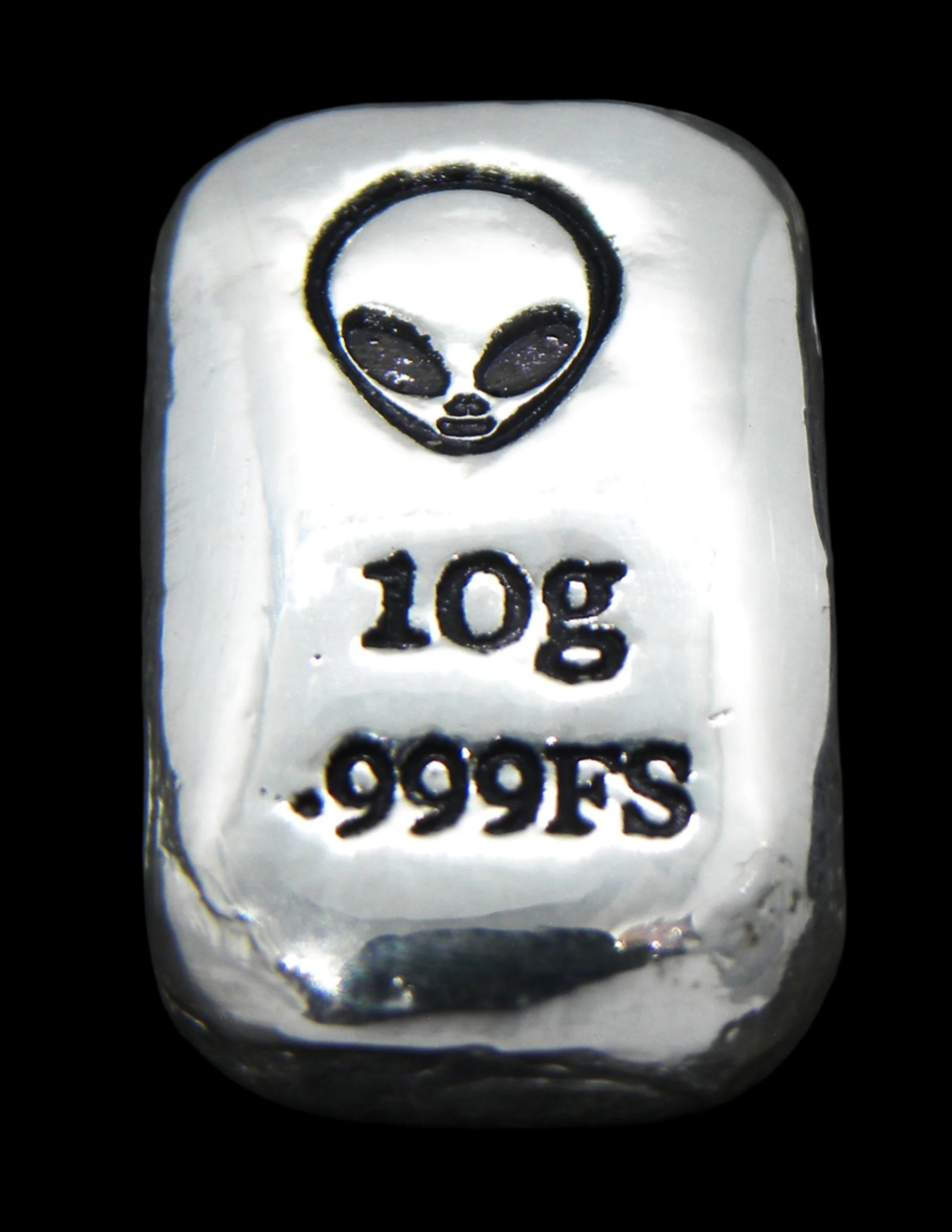 Close-up of a 10-gram 999 fine silver rectangular bar with a polished, reflective surface. The Alien head stamp is stamped on the top half of the bar and 10g 999FS on the bottom half. The bar is positioned vertically.