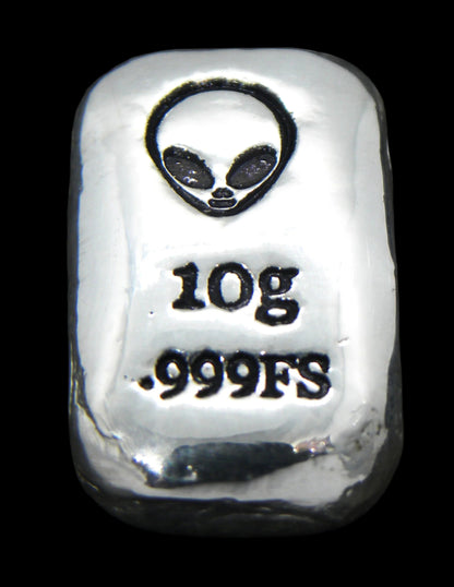 Close-up of a 10-gram 999 fine silver rectangular bar with a polished, reflective surface. The Alien head stamp is stamped on the top half of the bar and 10g 999FS on the bottom half. The bar is positioned vertically.