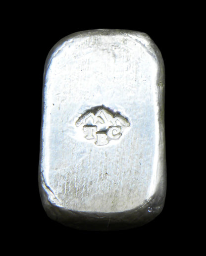 Back view of a 10g fine silver (999FS) bar, featuring a stamped TBC mountain range maker’s mark