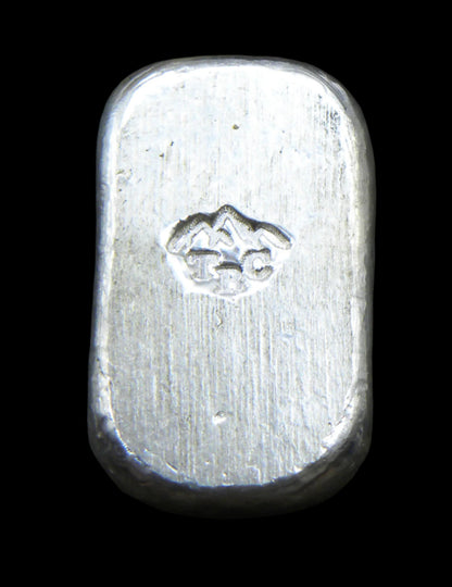 Back view of a 10g fine silver (999FS) bar, featuring a stamped TBC mountain range maker’s mark