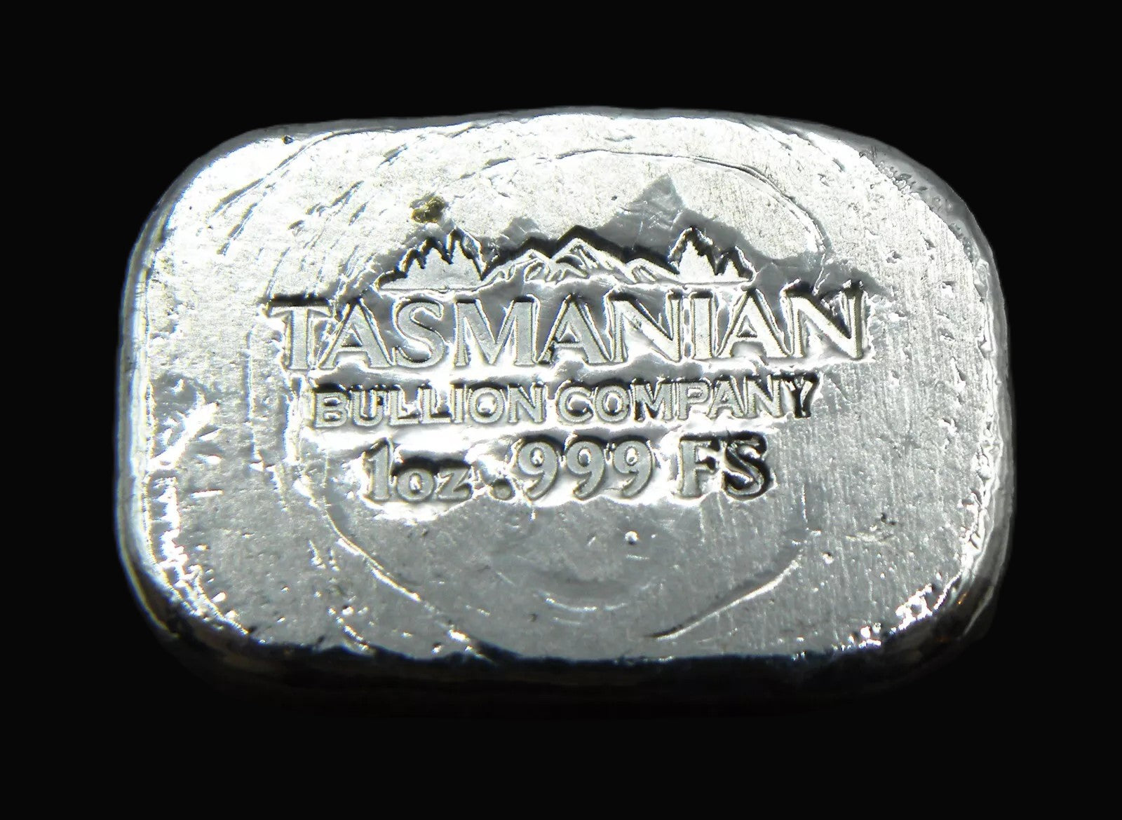 Close-up view of our 1oz hand-poured fine silver bar stamp. The detailed stamp with weight and purity markings highlights its handcrafted quality, making it a premium collectible from the Tasmanian Bullion Company.
