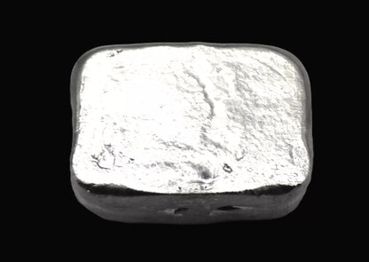 Close-up underside view of a 20g hand-poured fine silver bullion bar, featuring a smooth, high-polish surface with no markings. The reflective finish highlights its handcrafted quality and unique pouring texture, making it a premium investment piece from the Tasmanian Bullion Company
