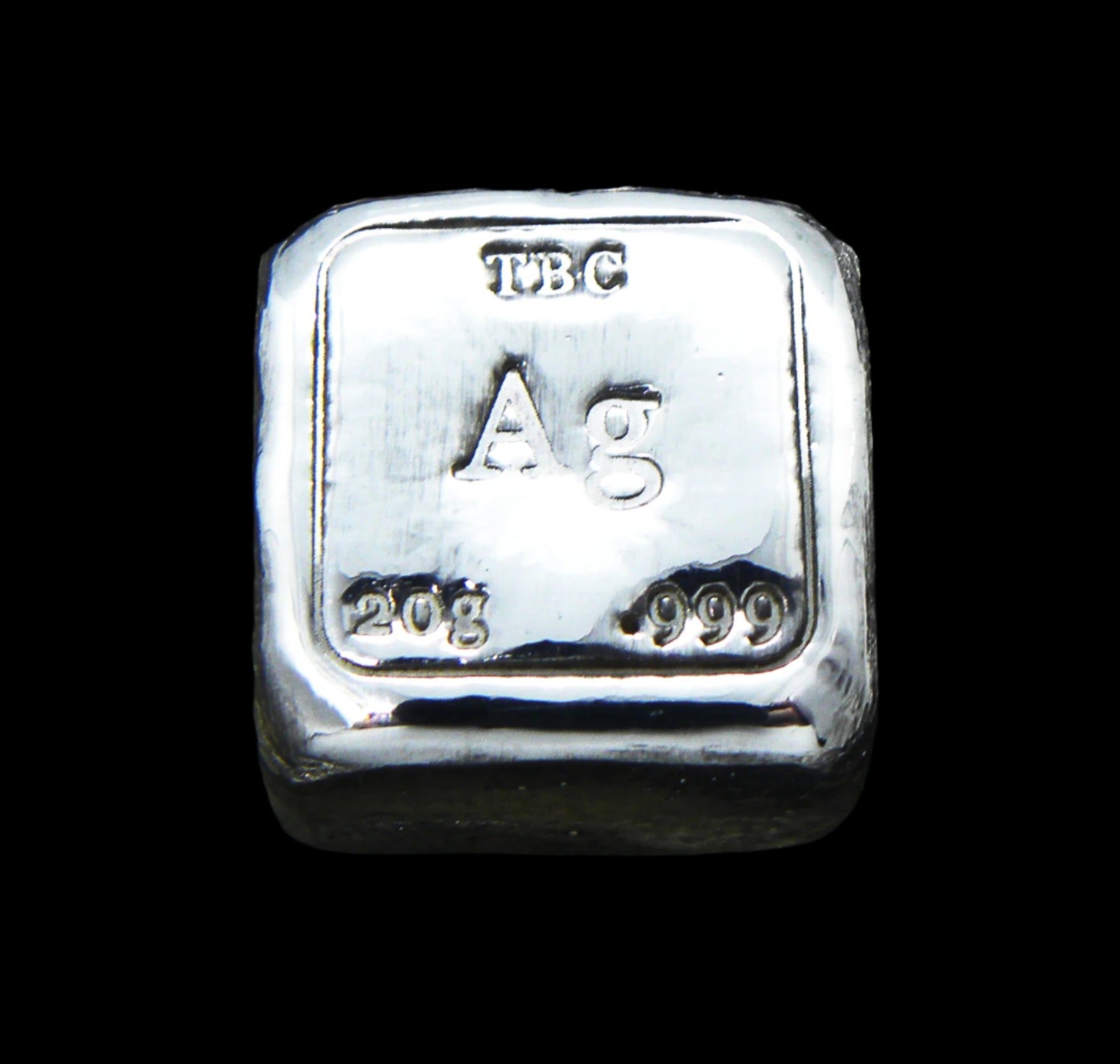 Close-up view of a 20g hand-poured fine silver bullion bar from Tasmanian Bullion Company, featuring prominent TBC, Ag, and 999 stamps. The high-polish finish and smooth edges highlight its handcrafted quality and unique pouring process, making it a premium investment piece.
