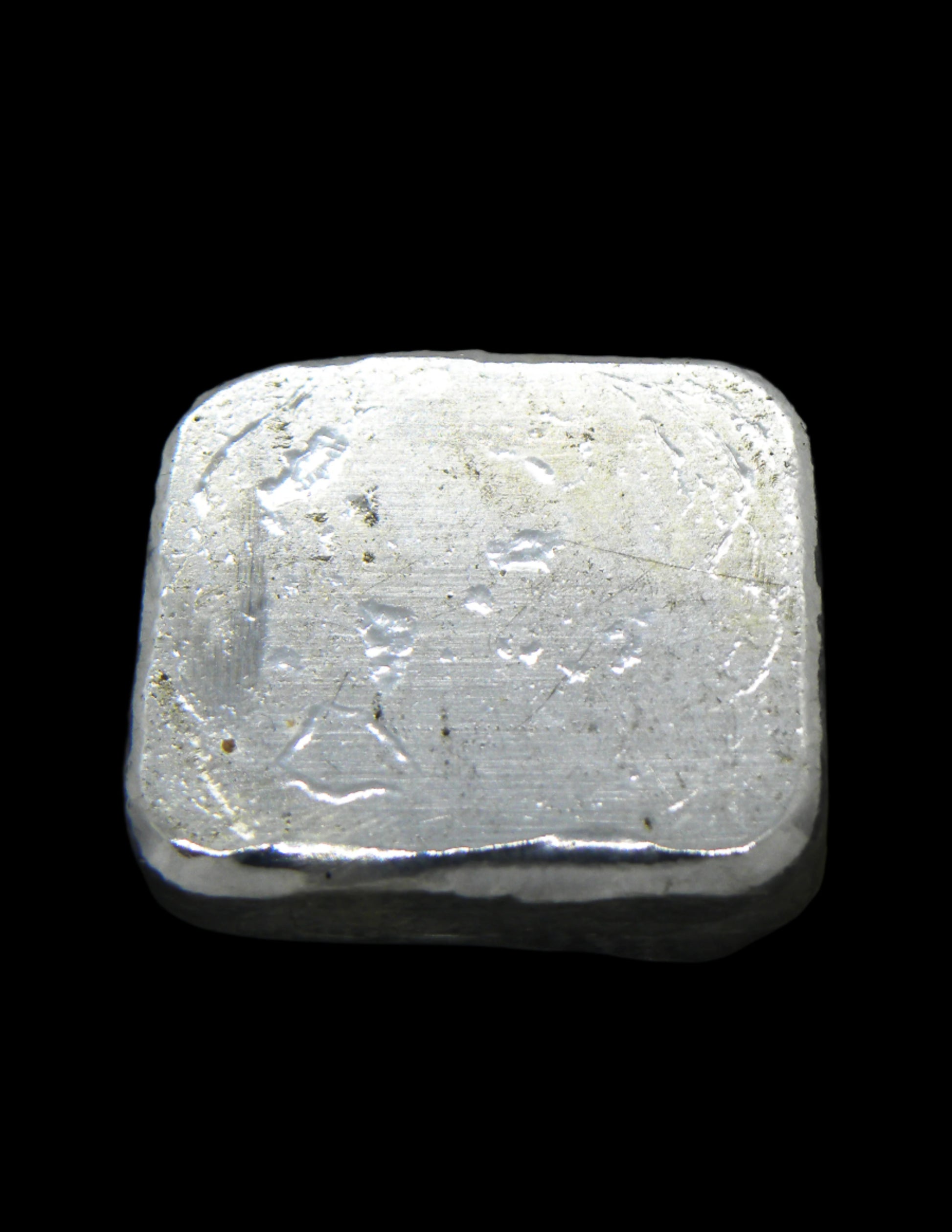 Underside view of a 20g hand-poured fine silver bullion bar, featuring a smooth, high-polish surface with no markings. The reflective finish highlights its handcrafted quality and unique pouring texture, making it a premium investment piece from the Tasmanian Bullion Company