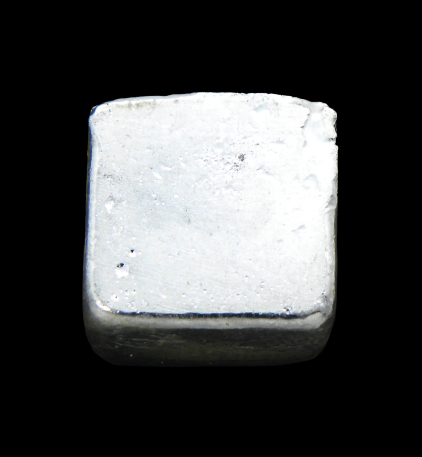 Close-up underside view of a 20g hand-poured fine silver bullion bar, featuring a smooth, high-polish surface with no markings. The reflective finish highlights its handcrafted quality and unique pouring texture, making it a premium investment piece from the Tasmanian Bullion Company
