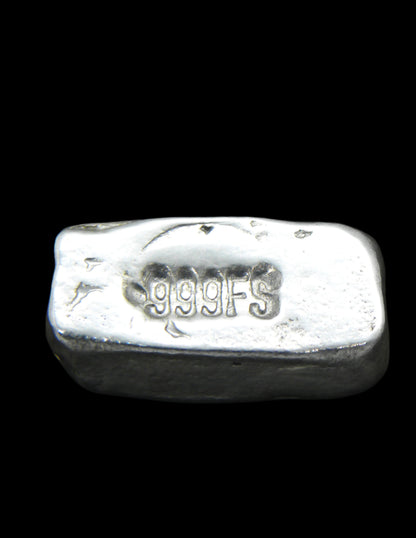 Reverse view of a 5g Hand-Poured Fine Silver Bar, showcasing a clearly stamped .999FS purity mark. The surface retains its unique hand-poured texture, enhanced by a black patina finish. Each bar is individually crafted in Tasmania, ensuring no two pieces are identical.